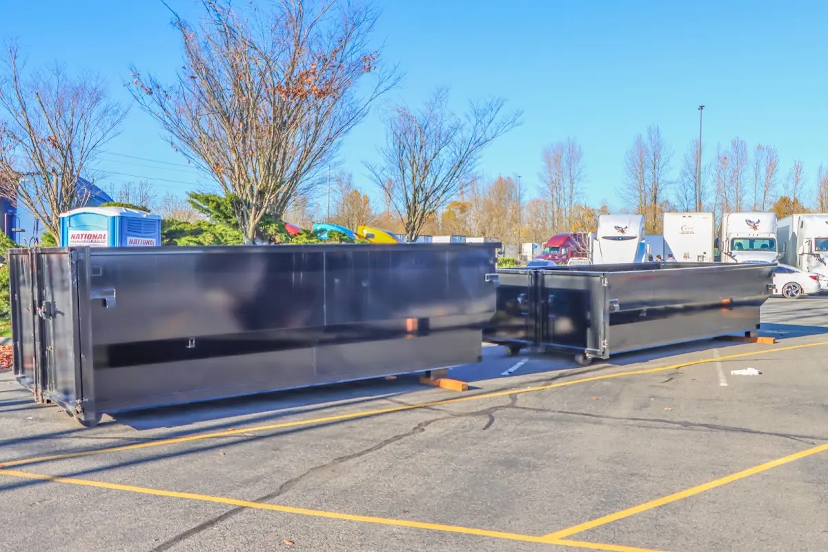 Professional dumpster rental service with roll-off container on residential driveway in Markham